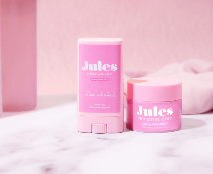 Bundle (Cramp Relief Stick 15ml + Cramp Relief Balm 30ml) displayed on a pink backdrop for menstrual care.